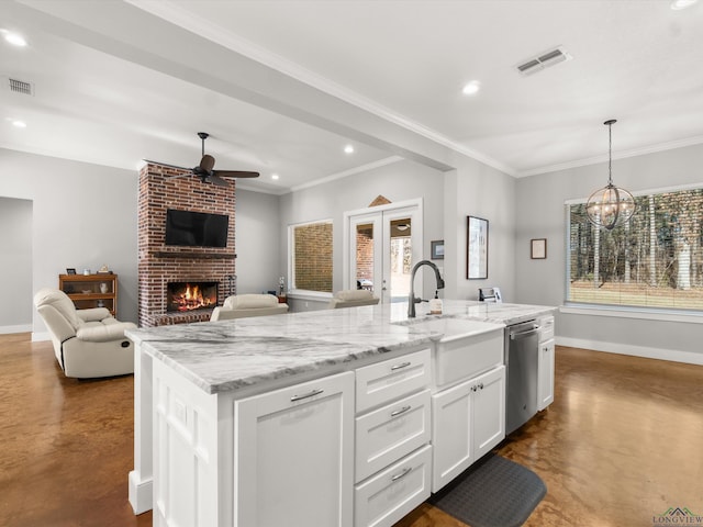 kitchen featuring white cabinets, a center island with sink, concrete flooring, and stainless steel dishwasher