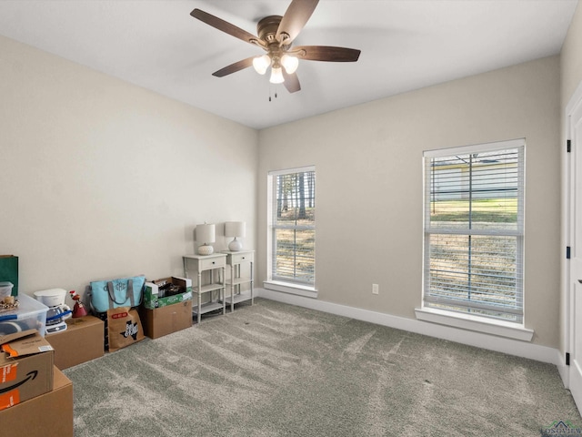 interior space featuring ceiling fan and a healthy amount of sunlight