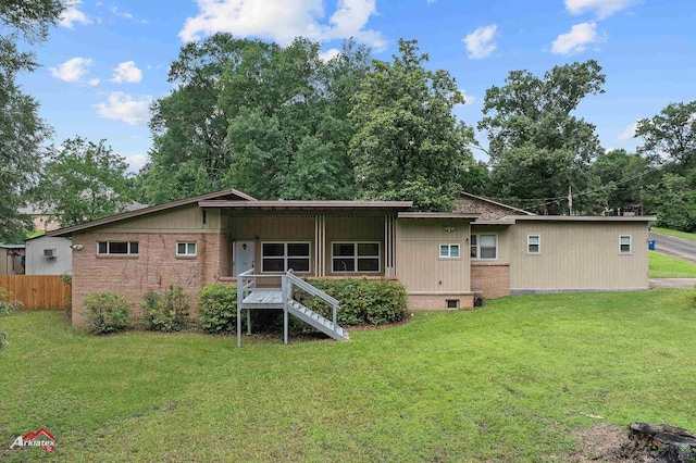 216 Hickory St, Gladewater, TX 75647 - rear view of property with brick siding