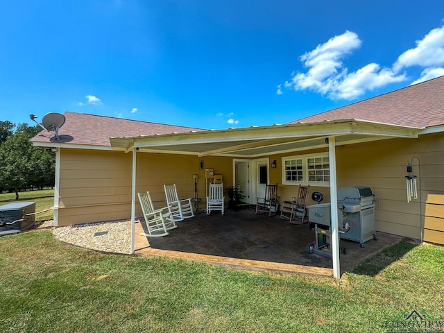 rear view of house featuring a lawn