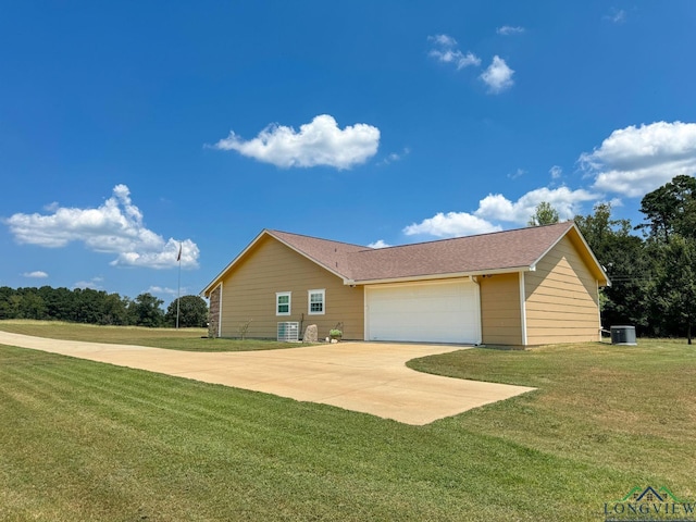 view of front of house with a garage and a front yard