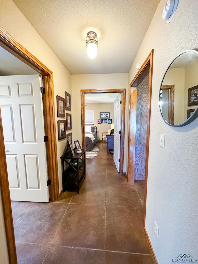 corridor with a textured ceiling