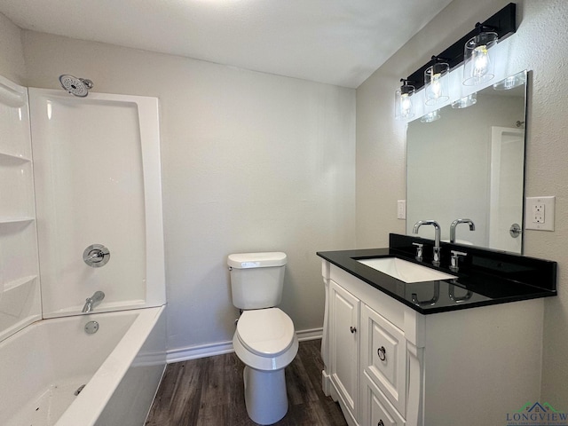 full bathroom with vanity, toilet, bathing tub / shower combination, and hardwood / wood-style floors