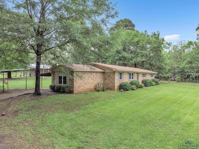 4202 Brent Rd, Longview, TX 75604 - view of front facade featuring a front yard and brick siding