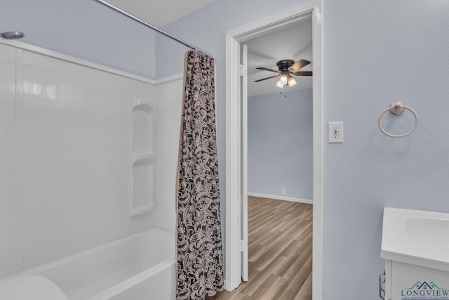 4202 Brent Rd, Longview, TX 75604 - full bathroom with ceiling fan, wood finished floors, vanity, shower / tub combo with curtain, and baseboards