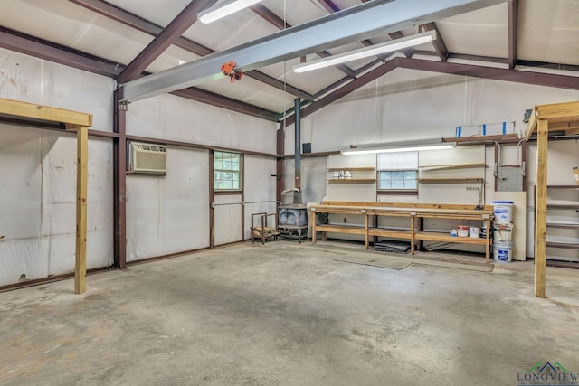 4202 Brent Rd, Longview, TX 75604 - garage with an AC wall unit and a wood stove