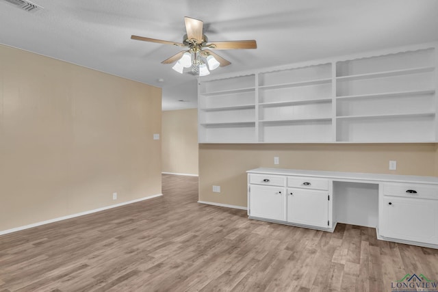 4202 Brent Rd, Longview, TX 75604 - unfurnished office featuring a ceiling fan, light wood-type flooring, and baseboards