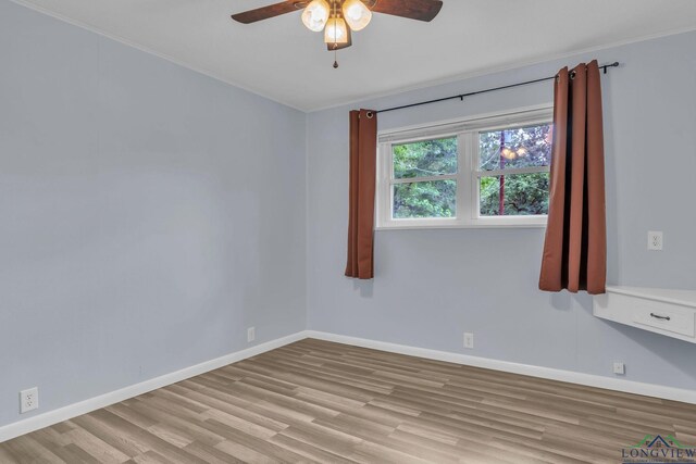 4202 Brent Rd, Longview, TX 75604 - spare room featuring light wood-style flooring, a ceiling fan, baseboards, and ornamental molding