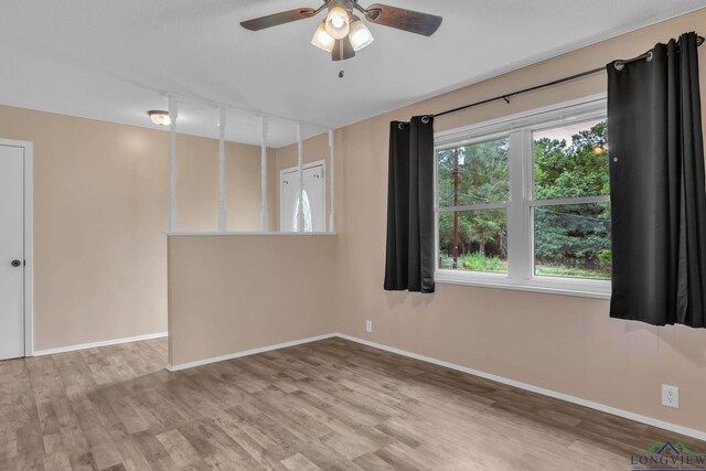 4202 Brent Rd, Longview, TX 75604 - spare room with wood finished floors, baseboards, and ceiling fan
