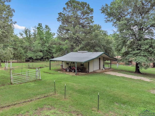 4202 Brent Rd, Longview, TX 75604 - view of yard with a garage, an outbuilding, and driveway
