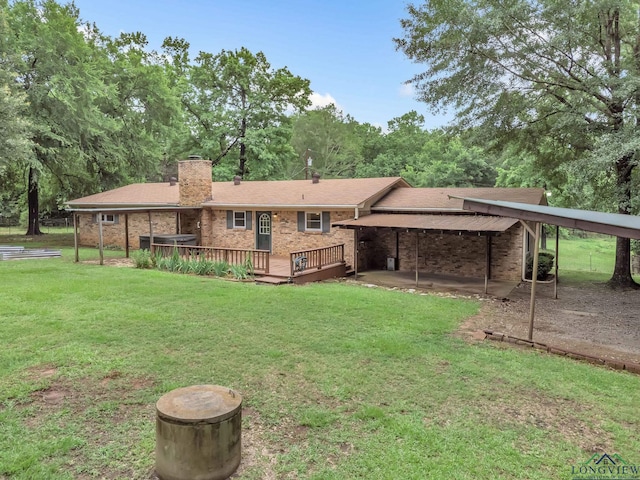 4202 Brent Rd, Longview, TX 75604 - rear view of property featuring a lawn, a chimney, a deck, and brick siding