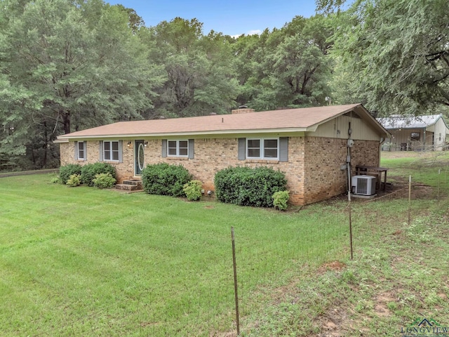 4202 Brent Rd, Longview, TX 75604 - ranch-style house with central AC unit, brick siding, and a front yard