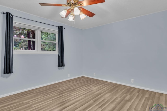4202 Brent Rd, Longview, TX 75604 - spare room with wood finished floors, baseboards, ceiling fan, and ornamental molding