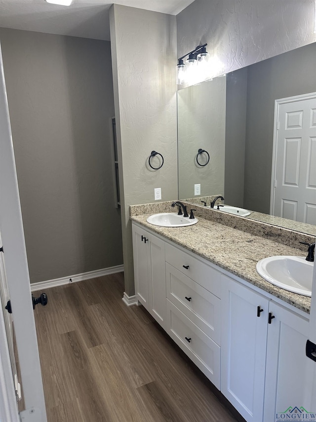 bathroom featuring hardwood / wood-style floors and vanity