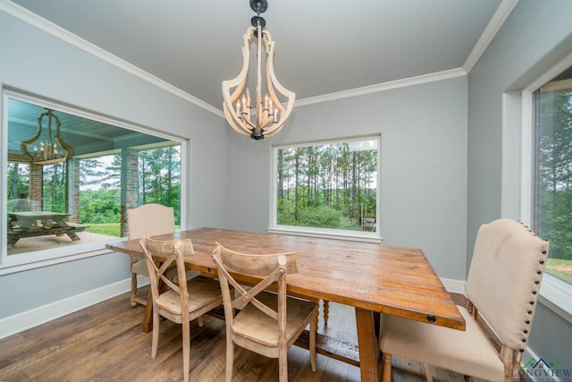 10740 Fm 2685, Gladewater, TX 75647 - dining room featuring a chandelier, crown molding, plenty of natural light, wood finished floors, and baseboards