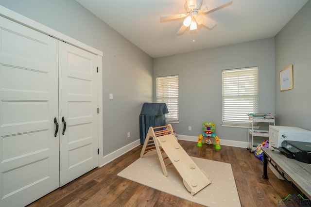 10740 Fm 2685, Gladewater, TX 75647 - recreation room with wood finished floors, a ceiling fan, and baseboards