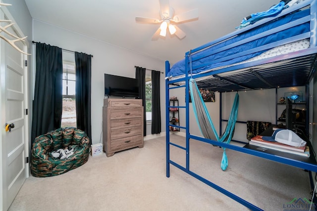 10740 Fm 2685, Gladewater, TX 75647 - bedroom with carpet flooring, a ceiling fan, and baseboards