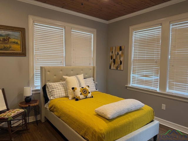 bedroom with baseboards, dark wood-type flooring, ornamental molding, and wooden ceiling