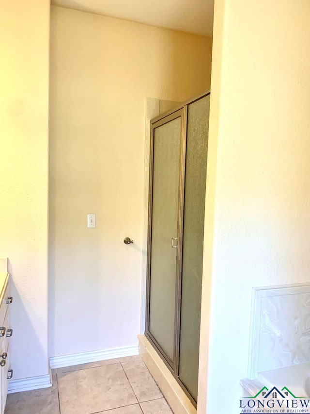 bathroom featuring tile patterned floors and walk in shower