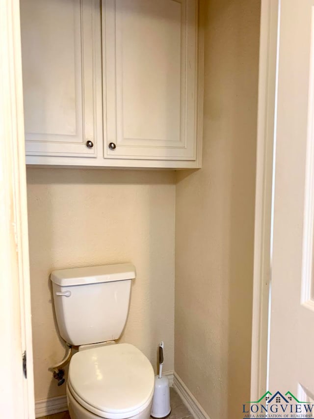 bathroom featuring toilet