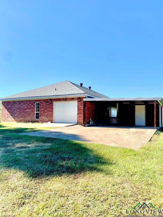 ranch-style house featuring a garage and a front yard