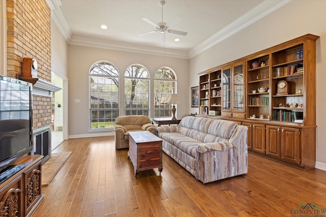 3314 Storey Lk, Tyler, TX 75707 - living area featuring ornamental molding, a wealth of natural light, ceiling fan, and wood-type flooring