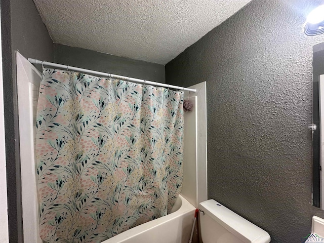 403 Church, Winnsboro, TX 75494 - full bathroom featuring toilet, shower / tub combo with curtain, a textured ceiling, and a textured wall
