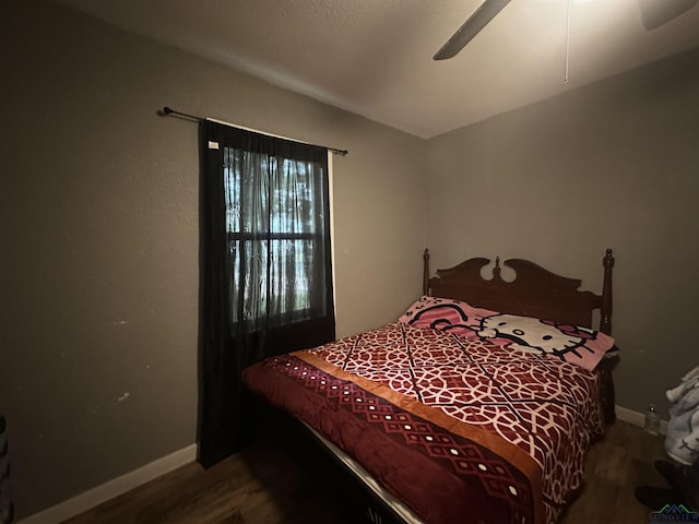 403 Church, Winnsboro, TX 75494 - bedroom with baseboards, a ceiling fan, and wood finished floors