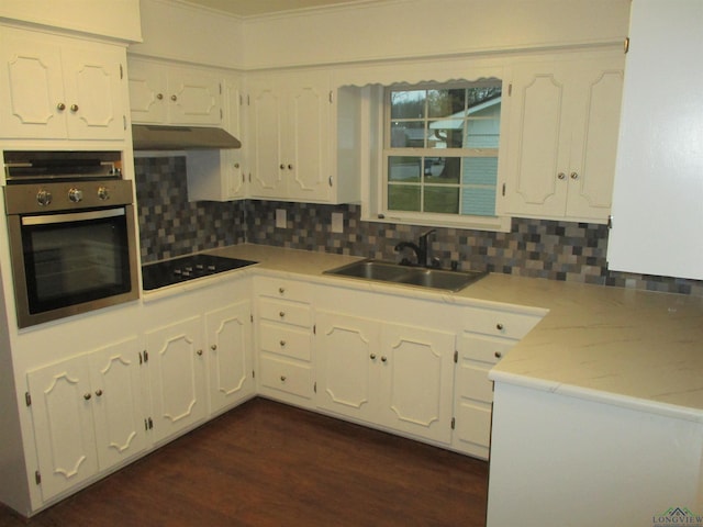 kitchen featuring white cabinetry, oven, and black electric cooktop