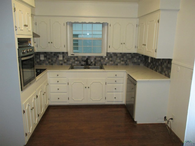 kitchen with white cabinetry, stainless steel appliances, sink, and backsplash