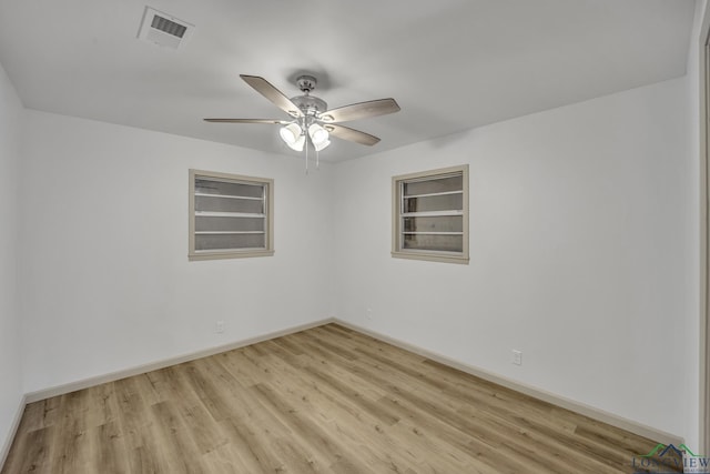 empty room featuring light hardwood / wood-style flooring and ceiling fan