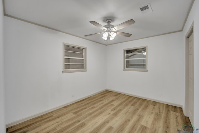 unfurnished room featuring crown molding, ceiling fan, and light hardwood / wood-style floors