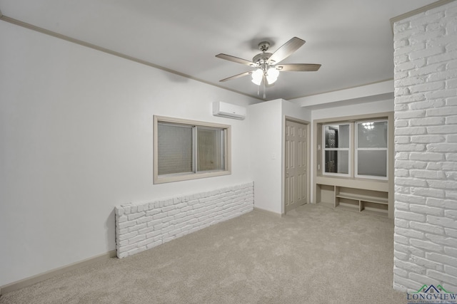 empty room with light carpet, a wall unit AC, and ceiling fan