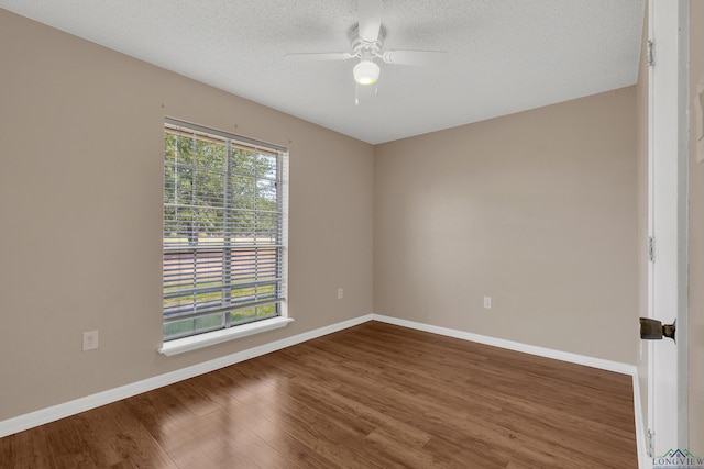 empty room with hardwood / wood-style floors, a textured ceiling, and ceiling fan