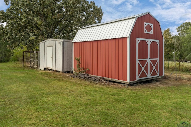 view of outbuilding featuring a yard