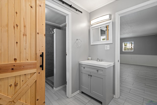 20505 Flat Creek Dr, Chandler, TX 75758 - full bath featuring vanity, a stall shower, ornamental molding, and a wainscoted wall