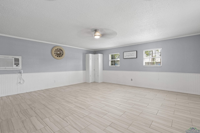 20505 Flat Creek Dr, Chandler, TX 75758 - spare room featuring a textured ceiling, wainscoting, a ceiling fan, crown molding, and a wall unit AC
