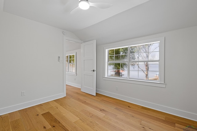 20505 Flat Creek Dr, Chandler, TX 75758 - unfurnished room featuring vaulted ceiling, a ceiling fan, and light wood-type flooring