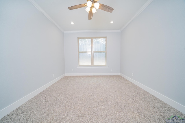 carpeted spare room with crown molding and ceiling fan