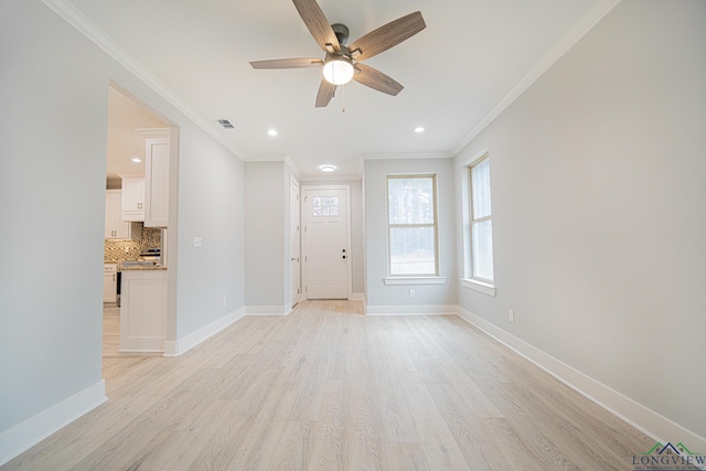 interior space with crown molding, light hardwood / wood-style flooring, and ceiling fan