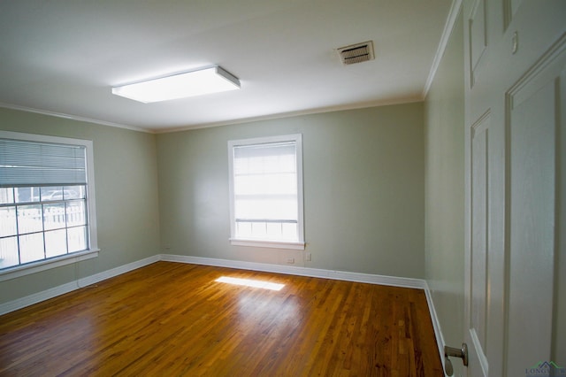 unfurnished room with dark hardwood / wood-style floors and ornamental molding