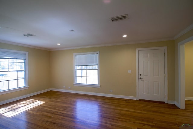 unfurnished room with dark hardwood / wood-style flooring and ornamental molding