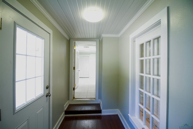 doorway featuring a healthy amount of sunlight, dark hardwood / wood-style flooring, ornamental molding, and wooden ceiling