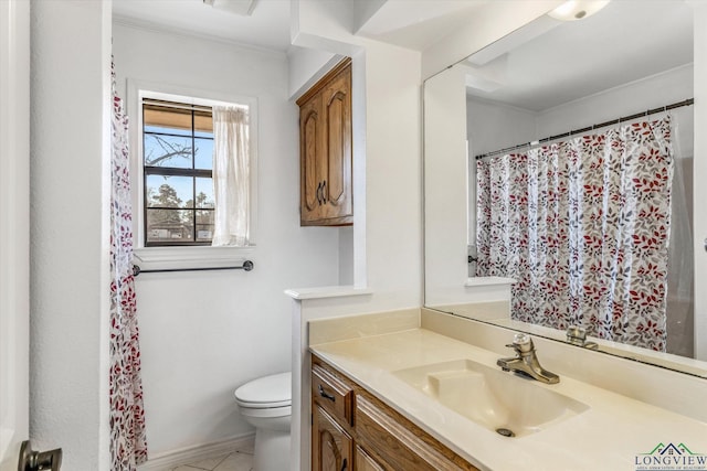 full bath with toilet, baseboards, ornamental molding, and vanity