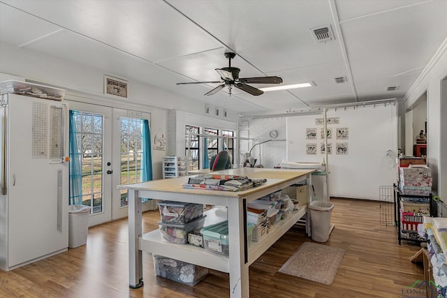 kitchen featuring french doors, visible vents, ceiling fan, and wood finished floors