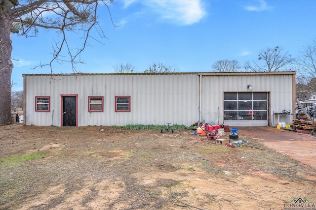 view of pole building with driveway