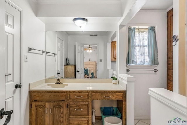 bathroom featuring visible vents, ceiling fan, ornamental molding, tile patterned floors, and vanity