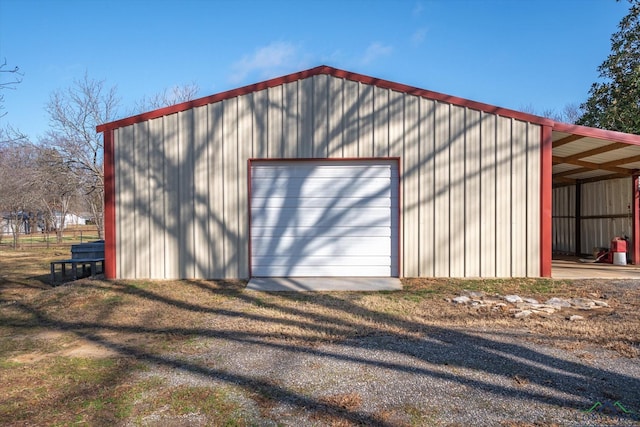 garage with a garage and driveway