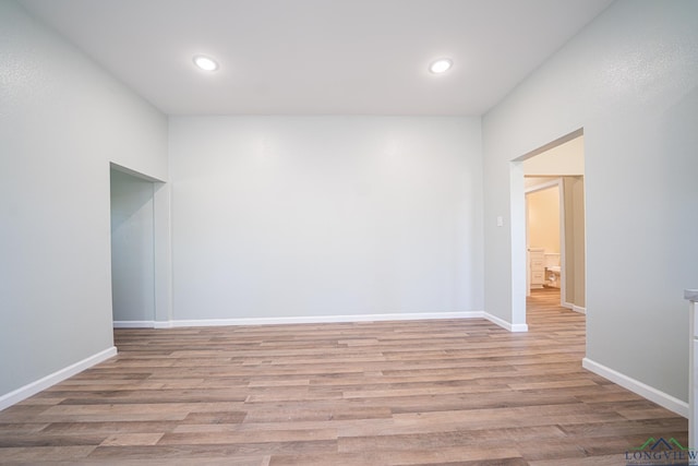 1104 N Bolivar St, Marshall, TX 75670 - empty room featuring baseboards, recessed lighting, and light wood-style floors