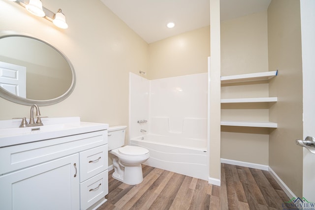 1104 N Bolivar St, Marshall, TX 75670 - full bathroom with toilet, wood finished floors, vanity, and shower / bath combination